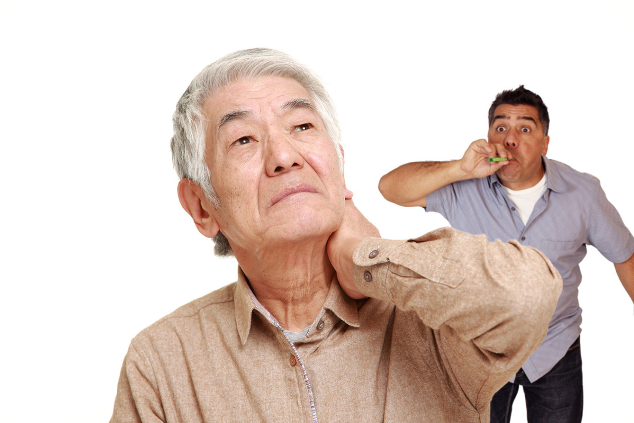 senior Japanese man suffers from neck ache; Shutterstock ID 256516558