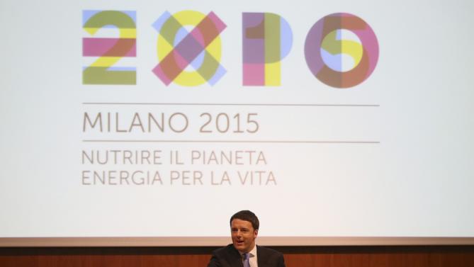 Italian Prime Minister Matteo Renzi delivers his speech during his visit in Milan, Italy, Tuesday, May 13, 2014. Renzi later visited the Expo 2015 construction site, where more than 132 countries will be establishing their pavilions for the world's fair that will open on May 1, 2015 and continue until the end of October of that year. (AP Photo/Antonio Calanni)