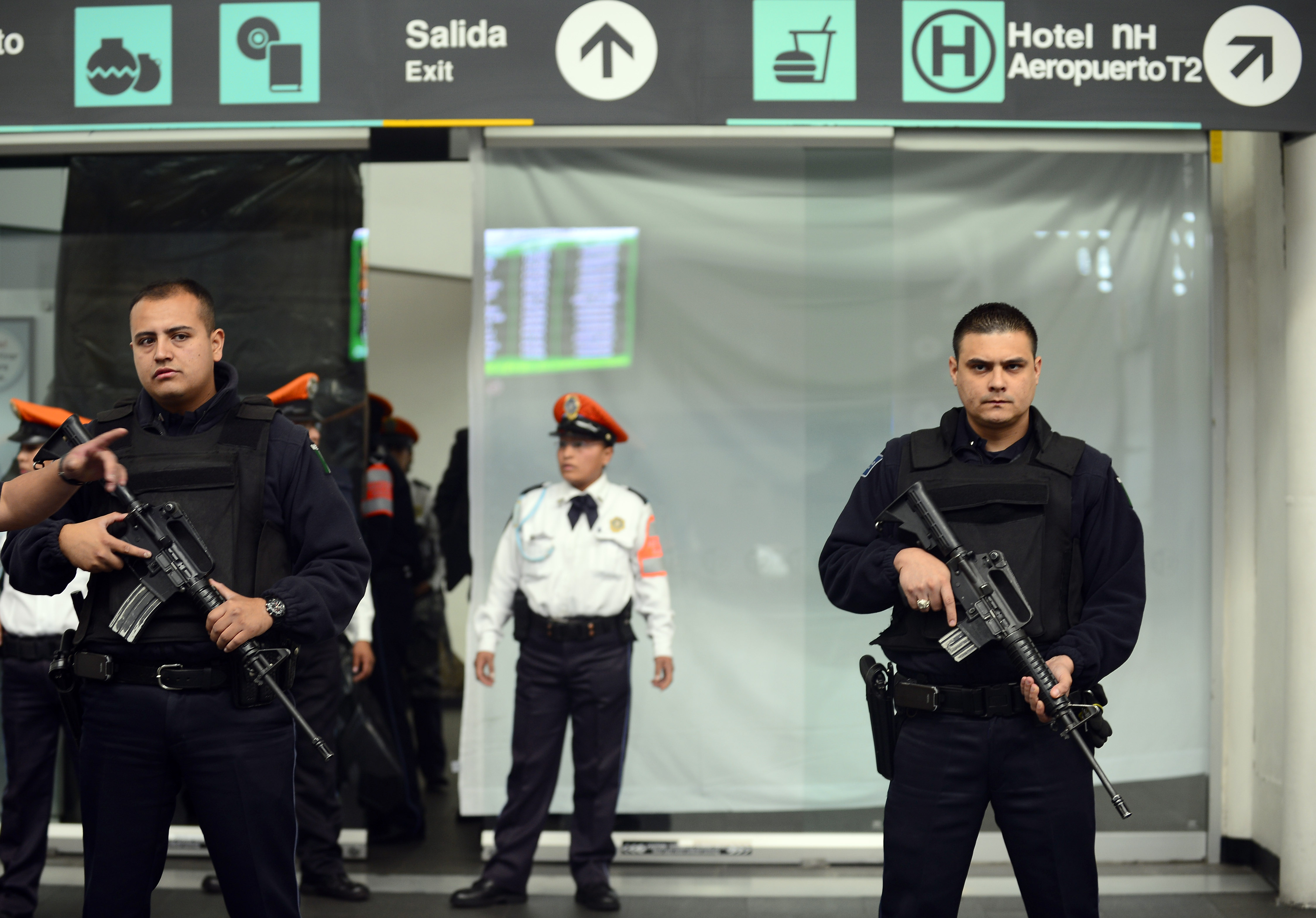 Federal Police officers stand guard at an entrance near the fast-food area of Benito Juarez international airport Terminal 2, in Mexico City where two police officers were shot dead and a third was wounded on June 25, 2012. Airport spokesman Jorge Andres Gomez said authorities are going through the security cameras to know the exact events of the shooting. AFP PHOTO/Alfredo ESTRELLAALFREDO ESTRELLA/AFP/GettyImages