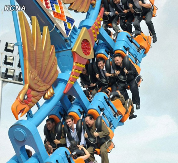 N. Korean leader's wife...epa03317770 North Korean leader Kim Jong-un (R in second row) smiles while enjoying a ride at the Rungna People's Pleasure Ground in Pyongyang in this image taken from the Web site of the (North) Korean Central News Agency on 26 July 2012. Kim, along with his wife Ri Sol-ju, attended a ceremony to mark the completion of the amusement park on July 25. EPA/KCNA SOUTH KOREA OUT NO SALES NO SALES