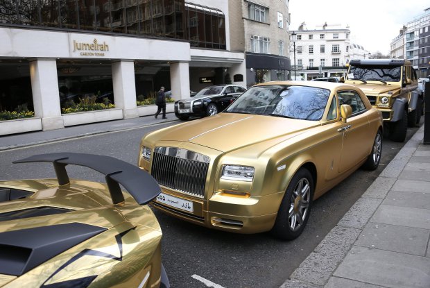 30.March.2016 - London - UK A fleet of golden supercars owned by a Saudi Prince! The Saudi Prince made sure he stood out during his London visit with a gold Lamborghini, Rolls-Royce and a six-wheeler Mercedes Benz. BYLINE MUST READ : XPOSUREPHOTOS.COM ***UK CLIENTS - PICTURES CONTAINING CHILDREN PLEASE PIXELATE FACE PRIOR TO PUBLICATION*** UK CLIENTS MUST CALL PRIOR TO TV OR ONLINE USAGE PLEASE TELEPHONE 0208 344 2007