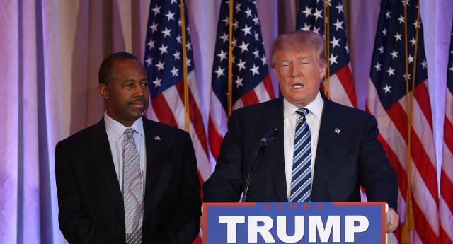 PALM BEACH, FL - MARCH 11: Republican presidential candidate Donald Trump stands with former presidential candidate Ben Carson as he receives his endorsement at the Mar-A-Lago Club on March 11, 2016 in Palm Beach, Florida. Presidential candidates continue to campaign before Florida's March 15th primary day. (Photo by Joe Raedle/Getty Images)