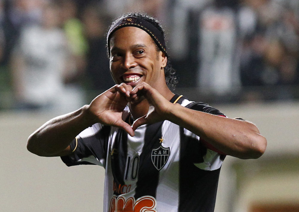 Brazil's Atletico Mineiro's Ronaldinho celebrates his team's victory over Argentina's Newell's Old Boys at the end of a Copa Libertadores semifinal soccer match in Belo Horizonte, Brazil, early Thursday, July 11, 2013.  Atletico Mineiro qualified for the Copa Libertadores final against Paraguay's Olimpia. (AP Photo/Bruno Magalhaes)